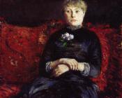 古斯塔夫 卡里伯特 : Woman Sitting on a Red Flowered Sofa